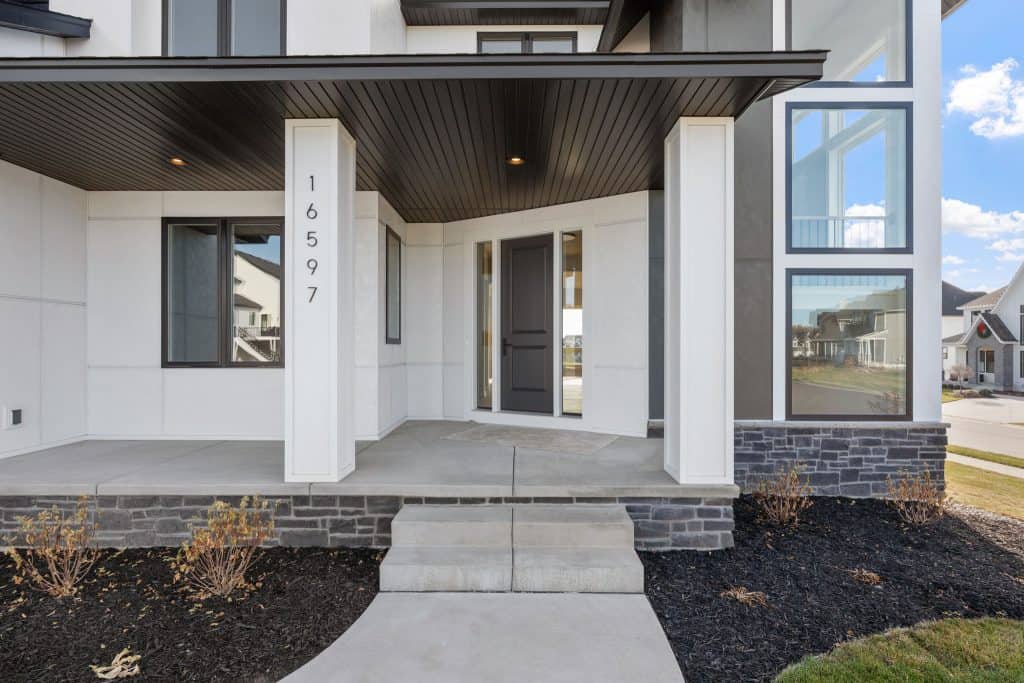 Modern concrete porch and steps for a stylish residential entrance, part of concrete services.