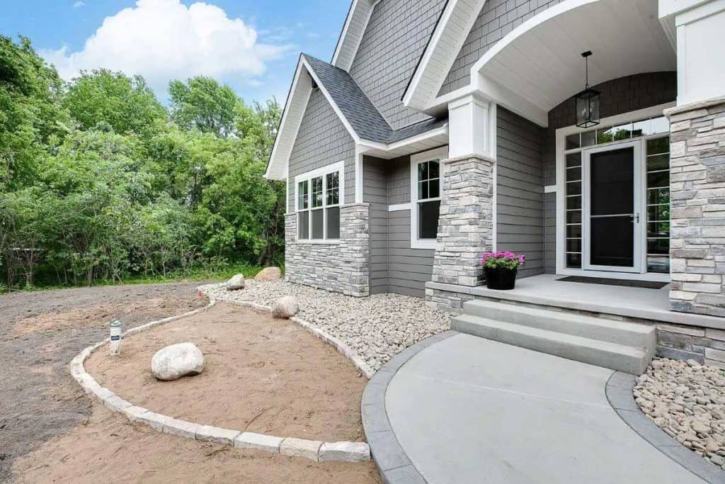 Modern home exterior with stone accents and steps