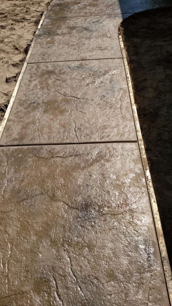 A lush concrete walkway with textured Layout 20 finish, perfect for outdoor projects.
