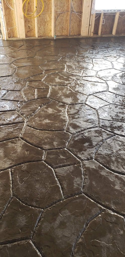 Polished concrete floor with decorative hexagon pattern in a residential project gallery.