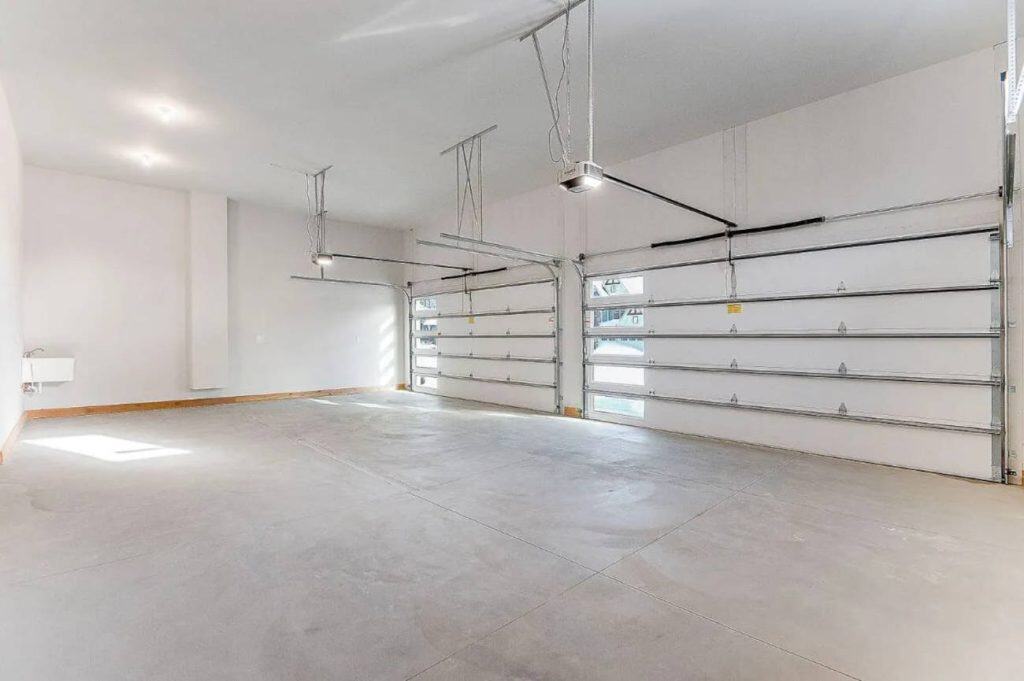 Spacious three-car garage with overhead doors